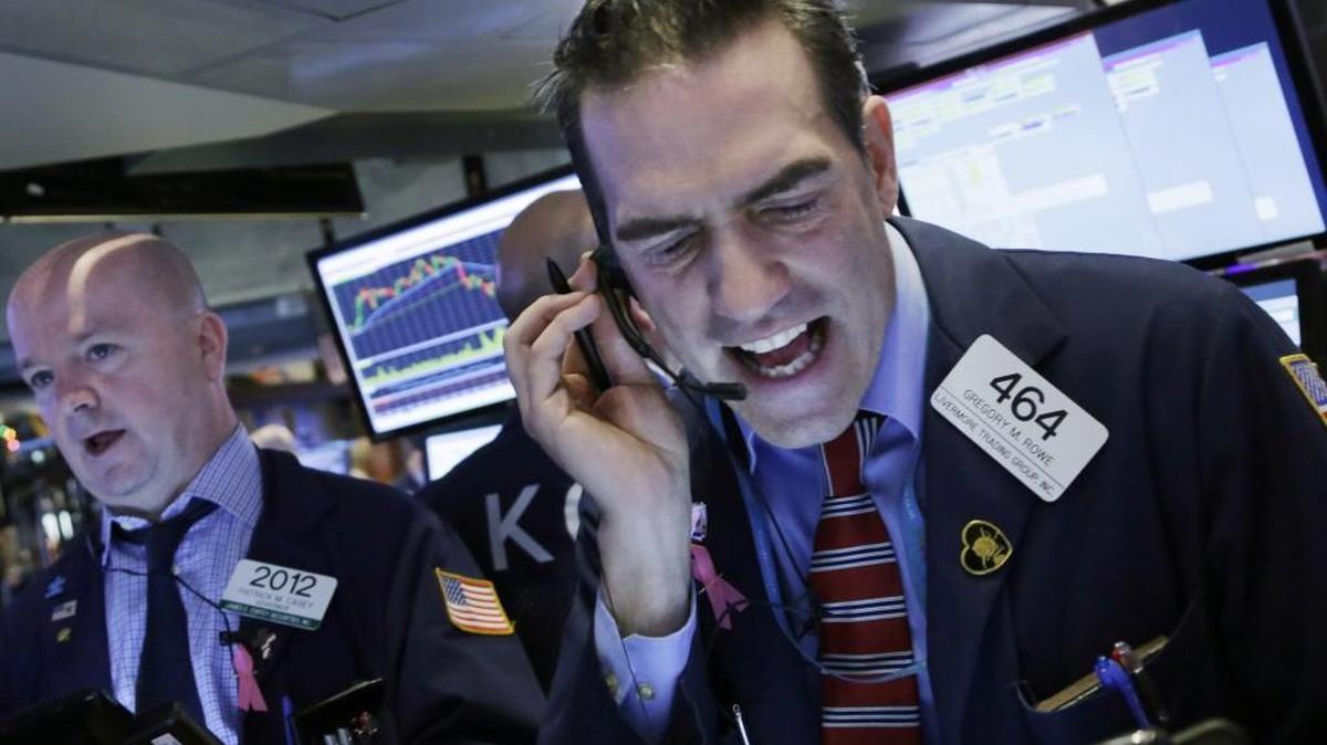 The Dow Jones industrial average dropped 390.97 points Friday, eliminating the gains from a rally Thursday and then some. Stock trader Gregory Rowe worked at the New York Stock Exchange during Friday’s sell-off.
