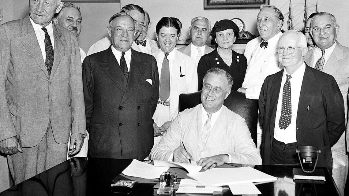 This Aug. 14, 1935, file photo shows President Franklin D. Roosevelt signing the Social Security Bill in Washington.