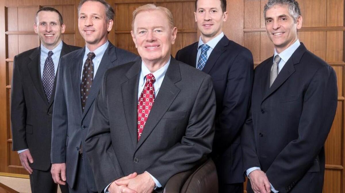 Phil Davidson (center) leads the value-style investment team at American Century. Other members are (from left): Brian Woglom, Kevin Toney, Dan Gruemmer and Michael Liss.