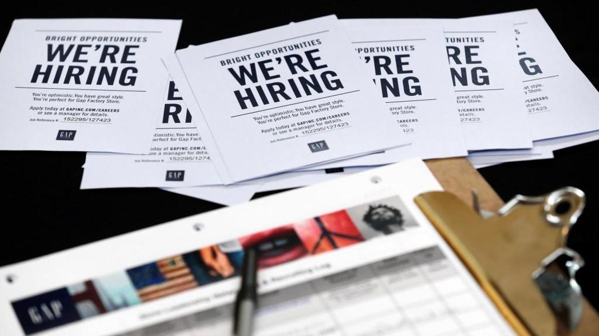 In this file photo, job applications and information for the Gap Factory Store sit on a table during a job fair at Dolphin Mall in Miami. On Friday, Aug. 4, 2017, the U.S. government issues the July jobs report.