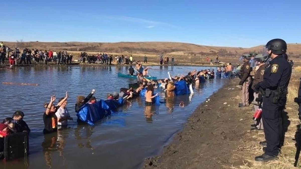 Police from six states have been marshaled by the state of North Dakota to attempt to shut down protests against the Dakota Access Pipeline by tribal members from across the country and their supporters. The pipeline is projected to cross the Missouri River within a half mile of the Standing Rock Sioux reservation.