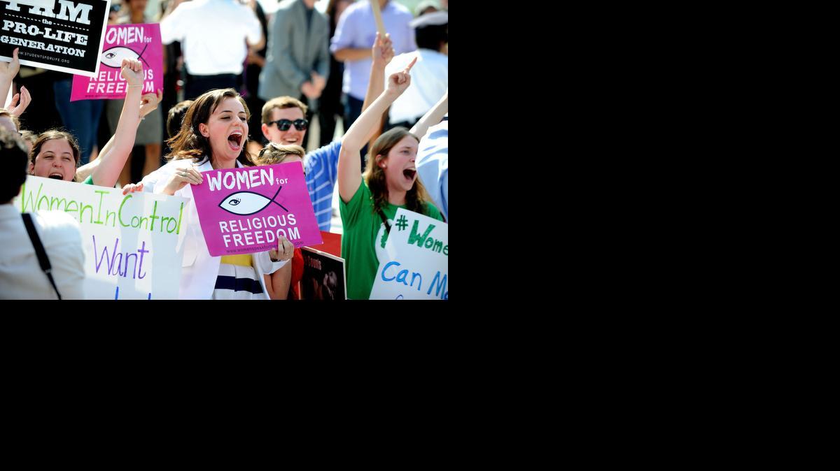 
Hobby Lobby supporters reacted to the U.S. Supreme Court decision Monday in Washington, D.C. The high court ruled in a 5-4 decision in favor of Hobby Lobby saying that some private companies can be exempted, on religious grounds, from health care reform’s requirement that employer sponsored health insurance policies cover contraception. 
