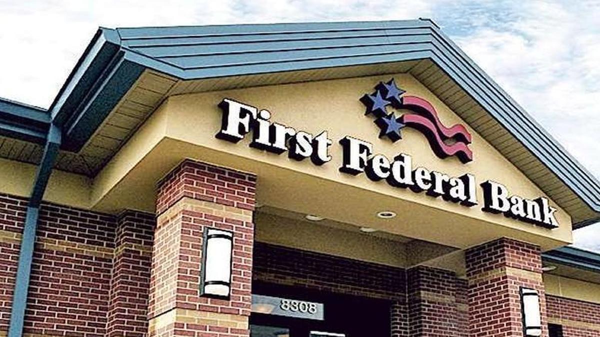 First Federal Bank agreed, if it gains regulatory approval for a proposed merger, to keep open three branches in census tracts with a majority minority population.