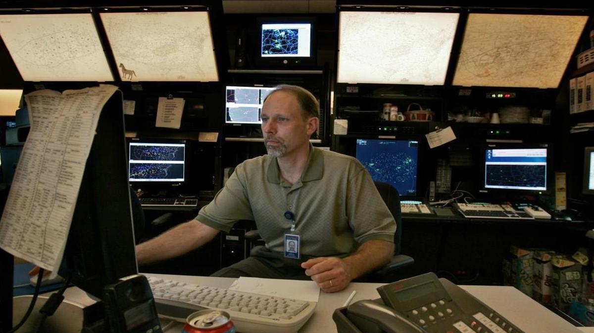On Monday, President Donald Trump unveiled a proposal to privatize air traffic control. Dan Wedekind, traffic management coordinator, checks data while working in the traffic management center at the FAA Air Traffic Control Center in Olathe, Kan., in this file photo.