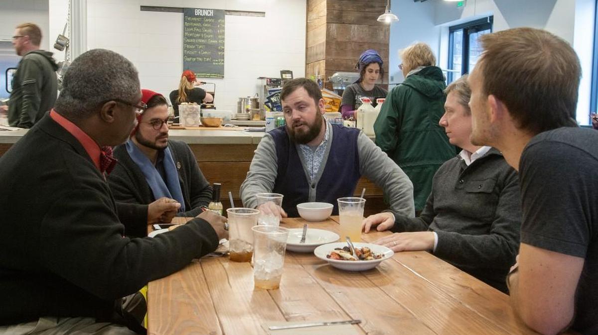 Mayor Sly James (from left), A. Good, The Sundry co-owner Aaron Prater, deputy administrator of the U.S. Small Business Administration Douglas Kramer and The Sundry co-owner Ryan Wing discussed the importance of small businesses Saturday at the Crossroads restaurant.
