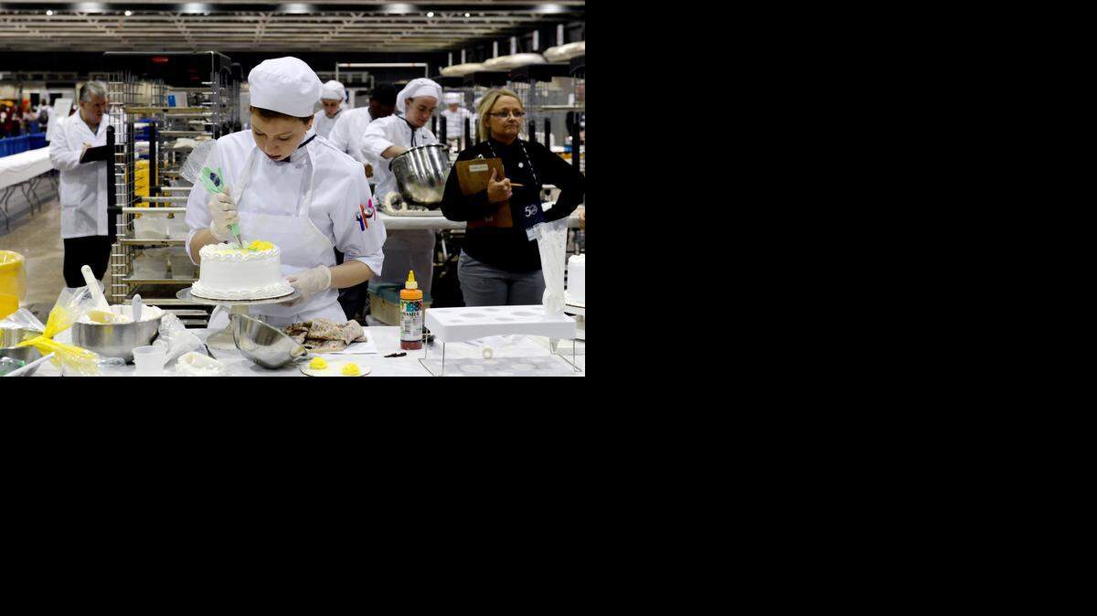 
Elisa Gentry decorated a cake Thursday morning during the national SkillsUSA competition.
