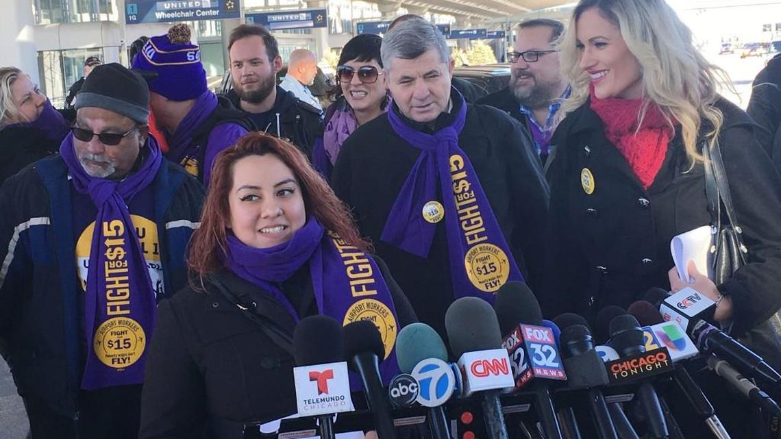Airport worker Raquel Brito (left) speaks at a news conference at O’Hare International Airport Nov. 21 in Chicago. Organizers of a Nov. 29 nationwide day of protests by hourly workers say a planned strike at O’Hare International Airport in Chicago, is only a part of their push for a $15 hourly wage and union rights.