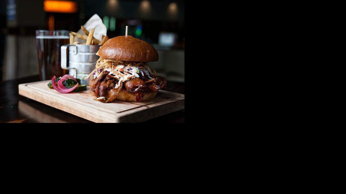 
Char Bar’s The Pickled Pig, a pulled pig on bun with cold slaw and deep-fired hot pickles.
