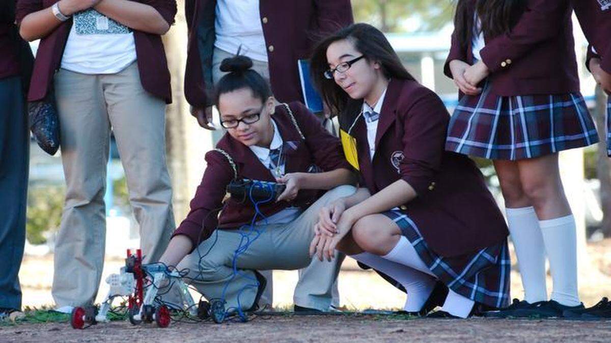 
Middle school students from Young Women’s Prep learn to drive a remote control rover during a science, technology, engineering and math workshop at Space Center Houston.
