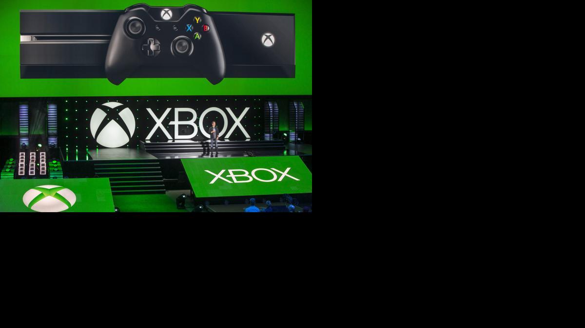 
Phil Spencer, head of Microsoft's Xbox division and Microsoft Studios, opens the Xbox presentation ahead of the Electronic Entertainment Expo at the University of Southern California's Galen Center on Monday, June 9, 2014 in Los Angeles. With the launch of the Xbox One, PlayStation 4 and Wii U in the video game industry's rearview mirror, the spotlight at E3 is expected to shift back to games. (AP Photo/Damian Dovarganes)
