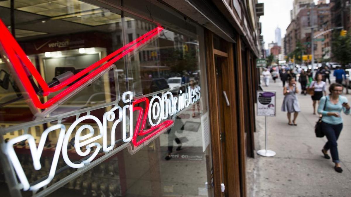 
Pedestrians used their cellphones while passing a Verizon Wireless store in New York. 

