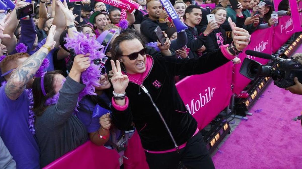 John Legere, CEO of T-Mobile US shown in a file photo, said Tuesday that he “couldn’t be more excited” by possible deal making for the telcom industry.