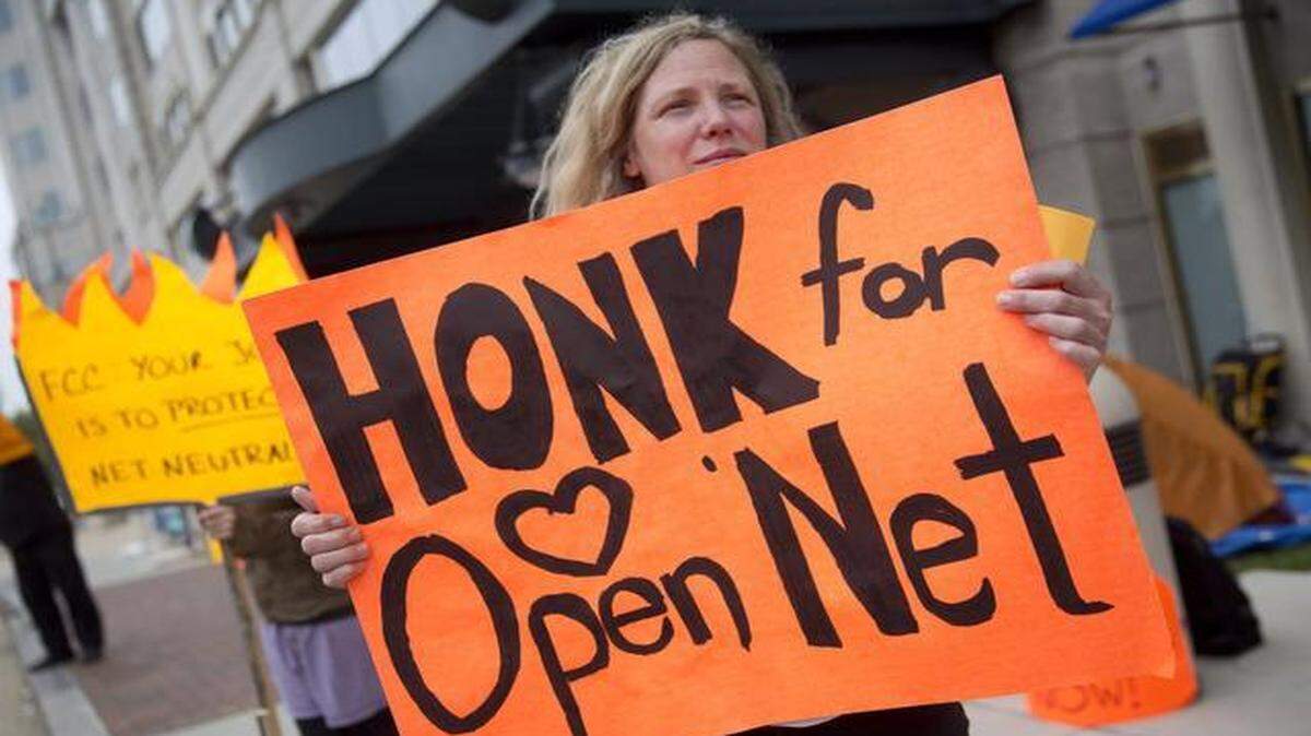 
Many members of the public called for continuing net neutrality and forbidding companies to pay for faster lanes on the Internet. Demonstrator Margaret Flowers showed her support of net neutrality last year outside the Federal Communications Commission headquarters in Washington, D.C.
