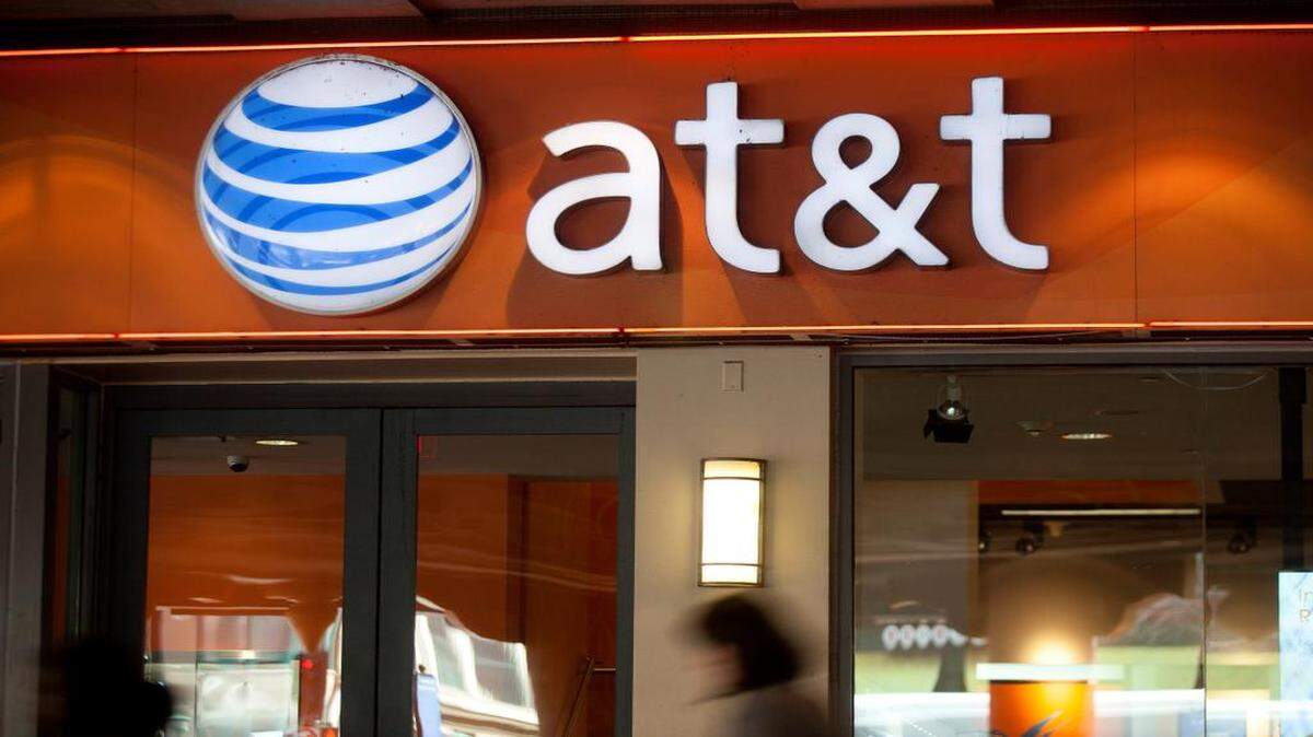 
Pedestrians passed an AT&T store in Washington on Tuesday.
