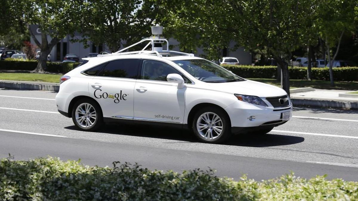 
The equipment on top indicates a Google self-driving car, here taking a test drive in Mountain View, Calif. 
