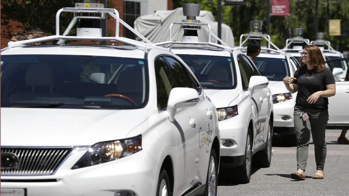 This May 13, 2014, file photo shows a row of Google self-driving Lexus cars at a Google event outside the Computer History Museum in Mountain View, Calif. As accidents involving self-driving cars have piled up —all minor scrape-ups for now —the arguments among programmers at places like Google and Carnegie Mellon University are heating up: Should they teach the cars how to commit infractions from time to time to stay out of trouble?
