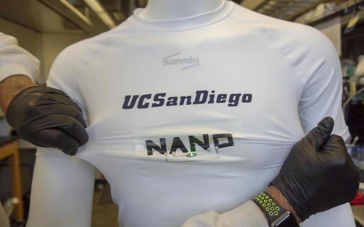 Stretchable batteries make up the word NANO and power a green LED light.
