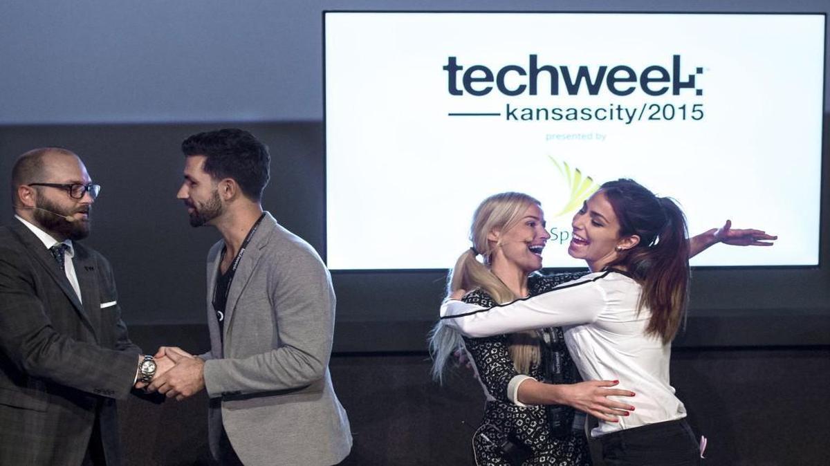 LaunchKC has announced its second contest for startups. At last year’s Techweek in Kansas City, Drew Solomon (left), co-founder of LaunchKC, shook hands with Scott Hanson of People’s Choice winner PopBookings, and Katy Lynch, CEO of Techweek Inc., got a hug from PopBookings’ Erika Klotz (right).