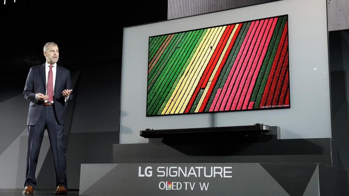 David VanderWaal, vice president of marketing for LG Electronics USA, unveils the LG Signature OLED TV W during an LG news conference before CES International, Wednesday, Jan. 4, 2017, in Las Vegas.