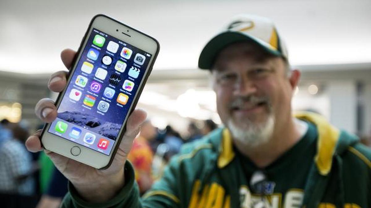 
John Mihalkovic of Virginia Beach, Va., showed off his newly purchased iPhone 6 Plus outside the Apple store at Lynnhaven Mall in Virginia Beach. 
