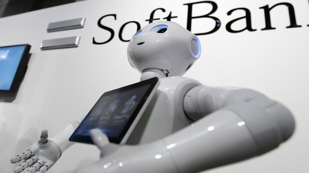 Pepper the humanoid robot, developed by SoftBank Group Corp., stands at the Pepper World 2016 event in Tokyo, Japan, in January. SoftBank opened an application store for its Pepper robots this week, allowing business customers to download software and put the humanoid machines to work.