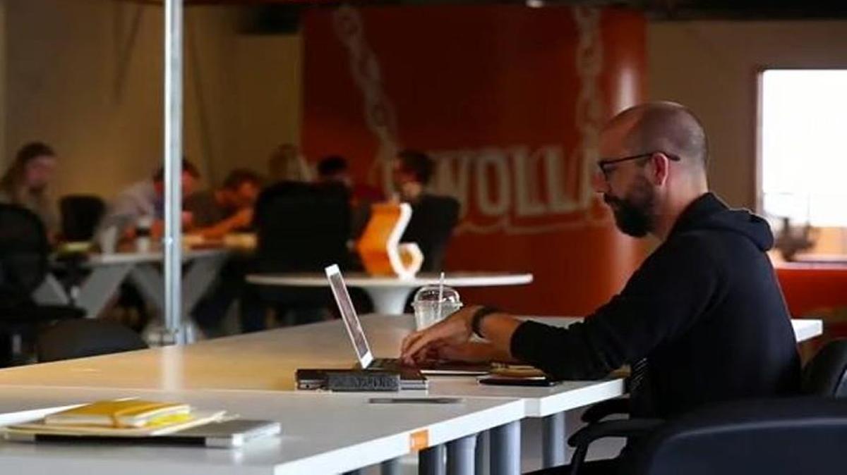 Dwolla Inc. CEO and founder Ben Milne works in the company’s offices.