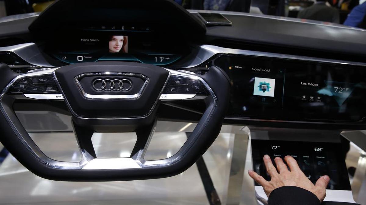 A demonstration shows the dashboard of the Audi AG E-Tron Quattro Concept vehicle during the 2016 Consumer Electronics Show in Las Vegas.