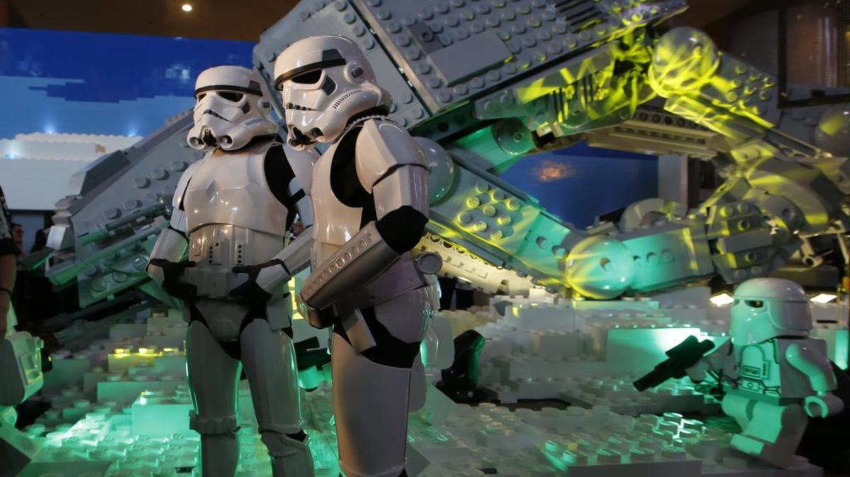 Models dressed as stormtroopers stood in front of the Imperial Walker during Tuesday’s opening ceremony of a Lego Star Wars exhibition in Hong Kong.