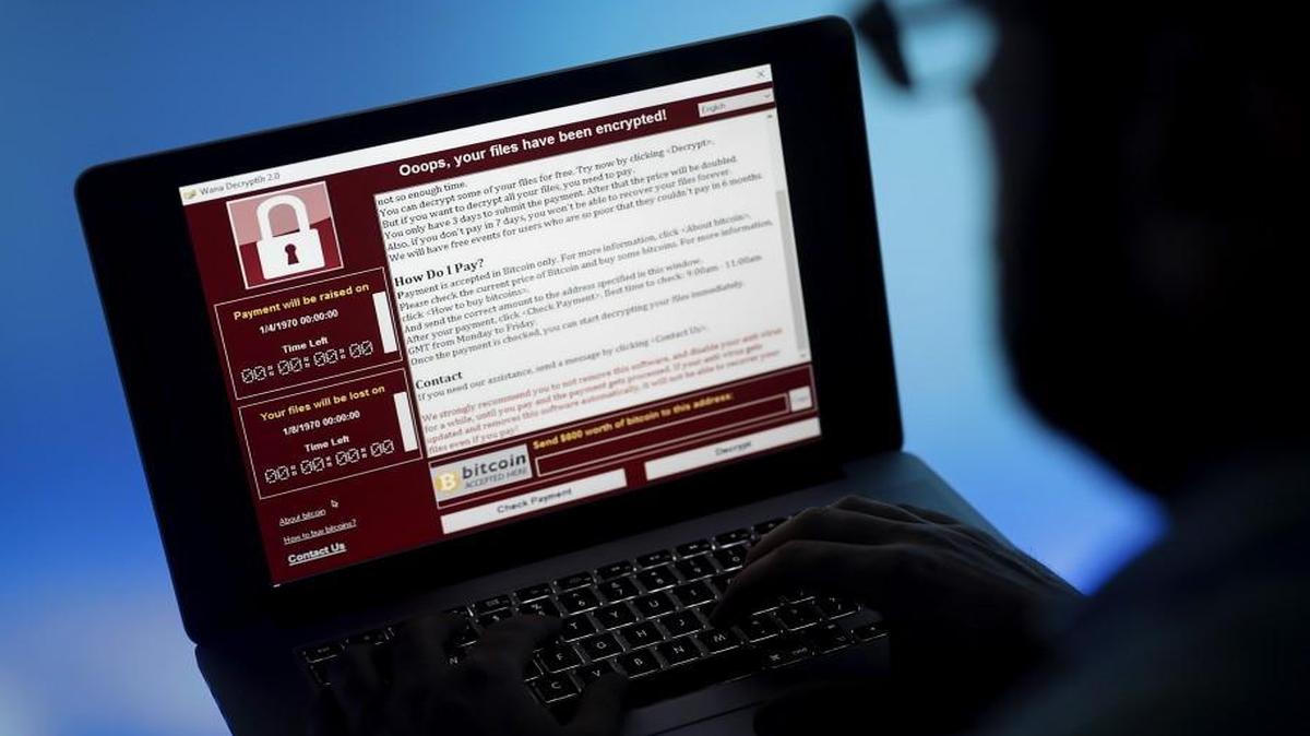 A lock screen from a cyberattack warns that data files have been encrypted on a laptop computer in this arranged photo in London.