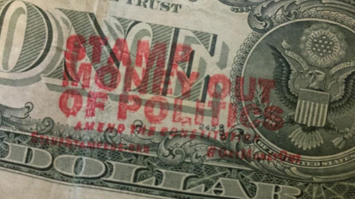 Stamping political messages on money is legal, according to the nonprofit that sells the stamps. StampStampede.org’s president is Ben Cohen, co-founder of Ben & Jerry’s Ice Cream.