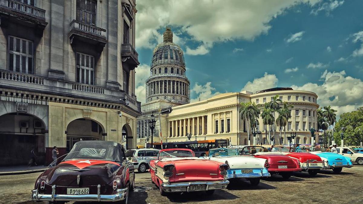 Old American cars in Cuba, pictured in this 2015 photo, epitomize the lack of trade between the United States and the island.