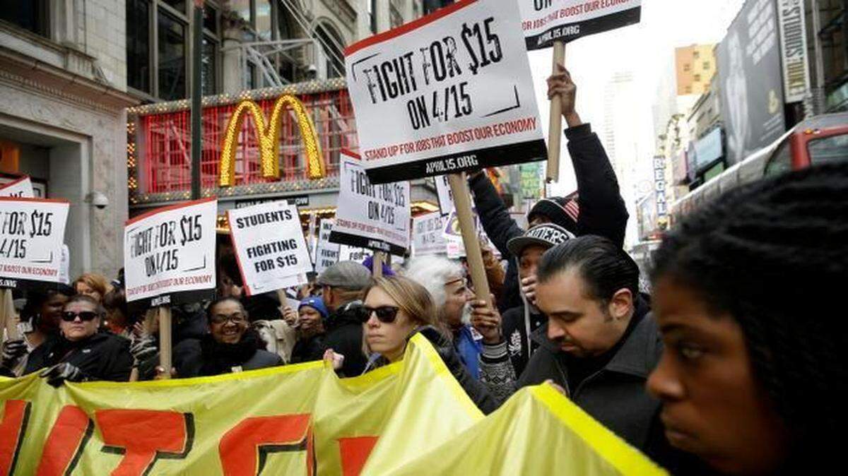 
People rallied Tuesday for higher wages in front of a McDonald’s in New York.
