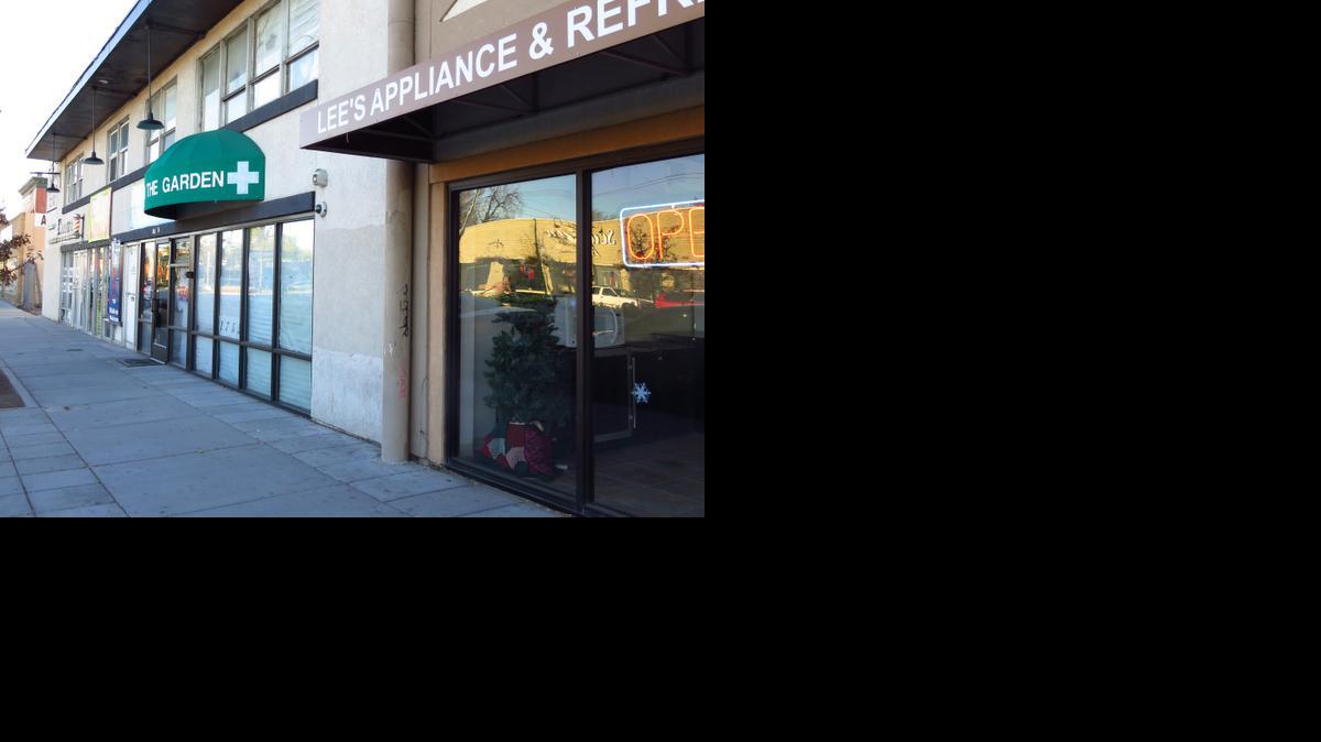 
A pot shop is next to an appliance repair business along south Broadway in Denver
