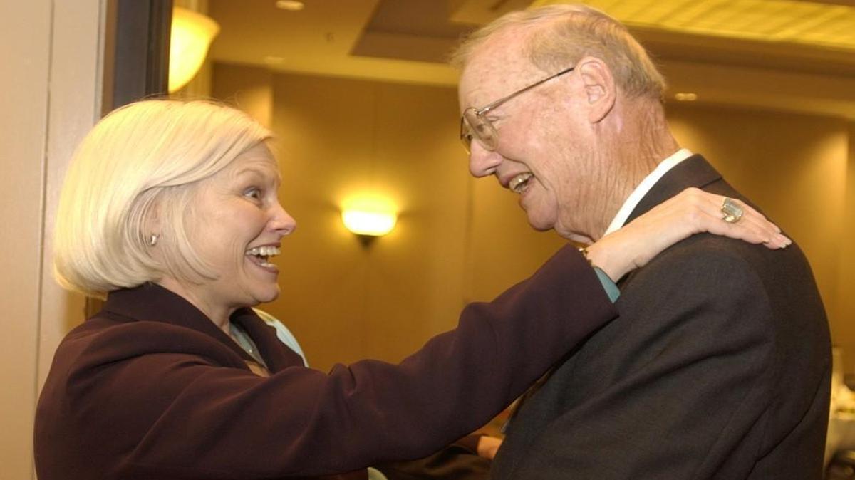 Ben Craig and Linda Carlsen smiled and greeted one another before a celebration in Craig's honor for 40 years with Metcalf Bank in 2004.