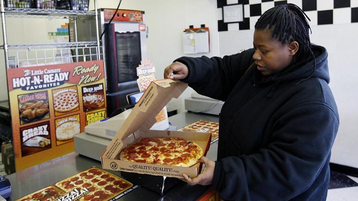 The owners of area Little Caesars pizza shops are in a courthouse battle over the price of Hot-N-Ready pizzas as several of their stores are reported as closed.