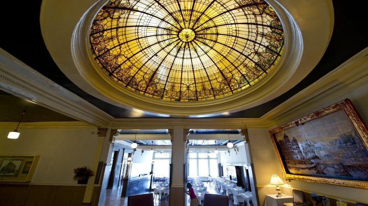 
Development firm 21C has expressed interest in refurbishing the Hotel Savoy into a high-end boutique. Part of the old main lobby (rear) now serves as a dining hall for special events. Mely Puente, 6, the granddaughter of owner Bill Lee, had it all to herself late Tuesday afternoon.

