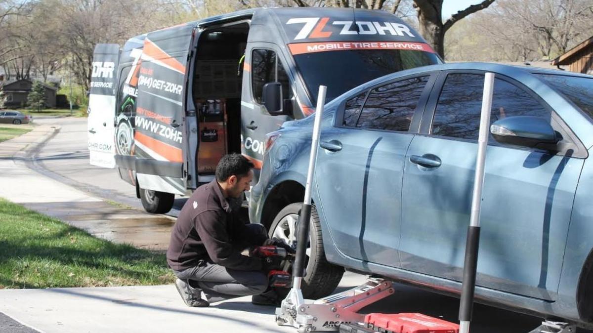 Komal Choong and his brother, both from the Northland, started Zohr Mobile Tire Service late last year. Choong will drive to a customer’s home or workplace to change, rotate and/or balance tires. He rotated a customer’s tires in Johnson County recently.