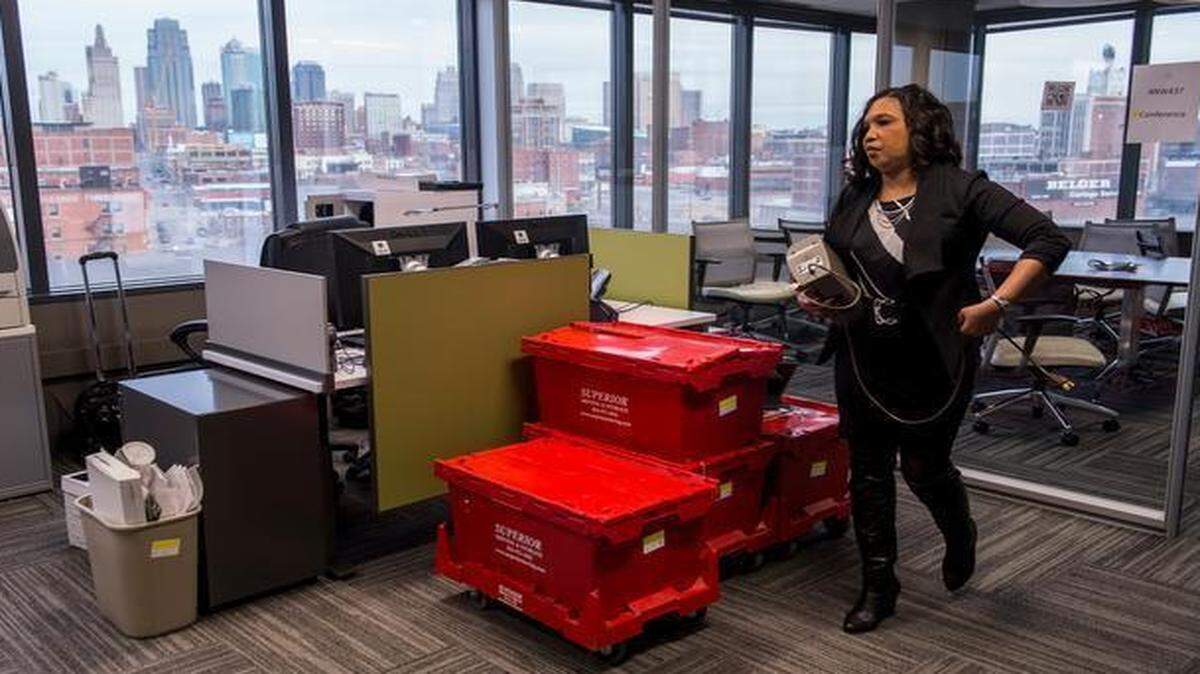 
Vicki Russaw unpacked her work items in her new office recently inside the Two Pershing Square office building at 2300 Main St. Russaw is one of about 900 General Services Administration employees who are moving from the Bannister Federal Complex to the downtown location.
