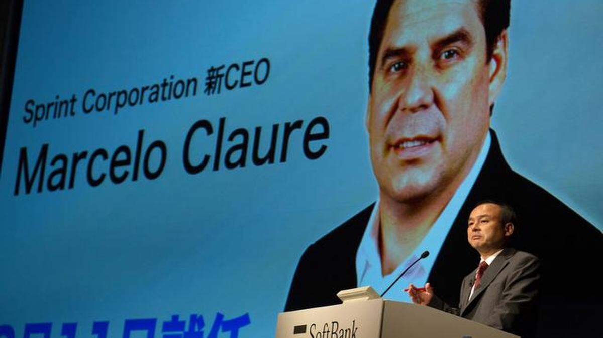 
Masayoshi Son, chairman and chief executive officer of SoftBank Corp., spoke Friday in front of an image of incoming Sprint Corp. Chief Executive Officer Marcelo Claure during a news conference in Tokyo.
