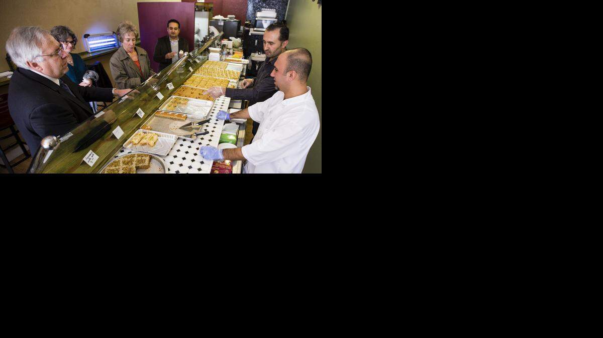 
Professors from KU Med, Ken Davis, Judy Bielby, Kay Folck, and Murad Moqbel visited Sultan’s Bakery last week. Sultan's Bakery is owned by Shero Alloush (in dark shirt at right) and the treats are baked by his cousin, Ali Mahou.
