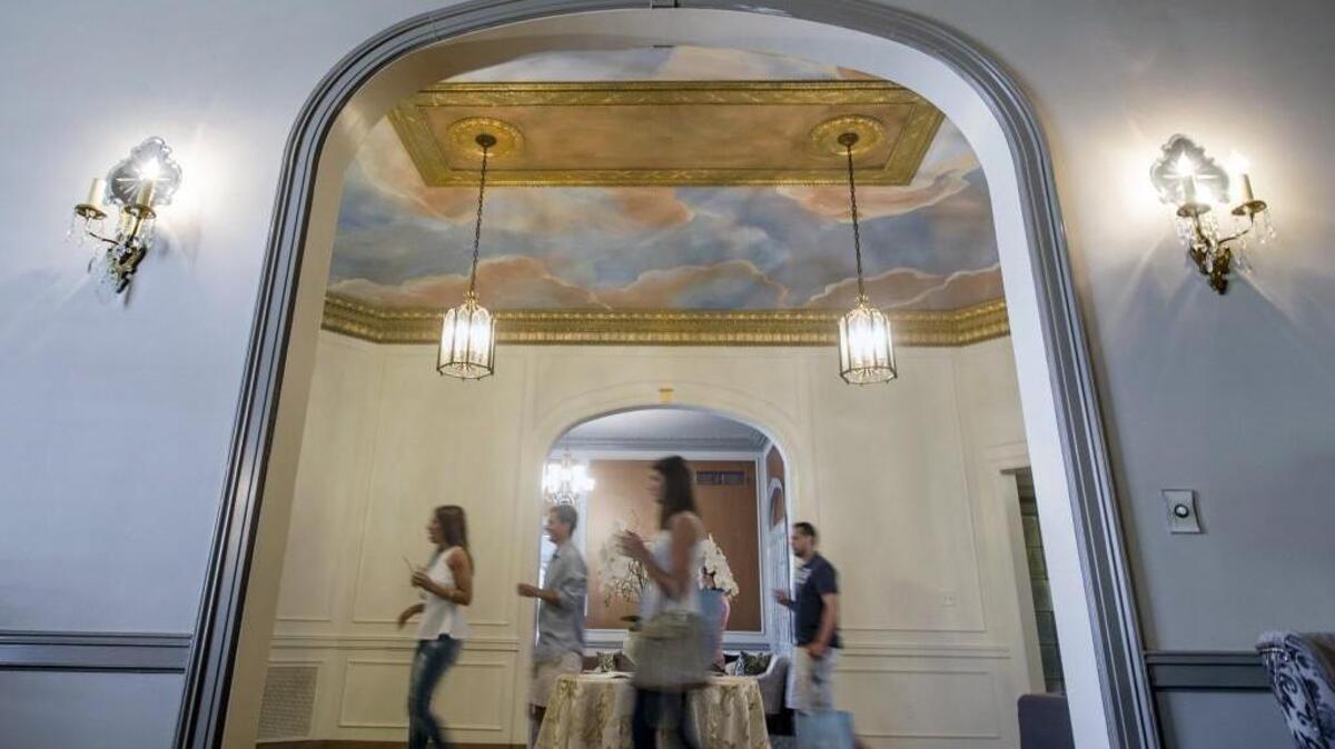 
The foyer of The DeLeon features a painted ceiling. Co-owner Jodie DeLeon says she and her husband spent about $150,000 to renovate the former funeral home into an events space.
