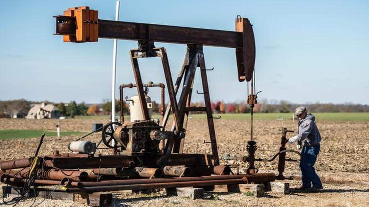 Jerry Billbe, a pumper with Colt Energy, checks an area well. Jackson and Cass counties have contributed to Missouri’s recent increase in production.