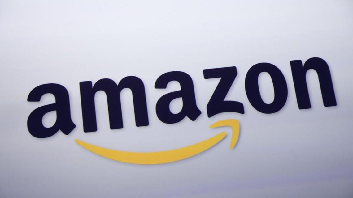 The Amazon.com logo is displayed at a news conference in New York. The online retail giant will begin collecting sales tax in Missouri next month.