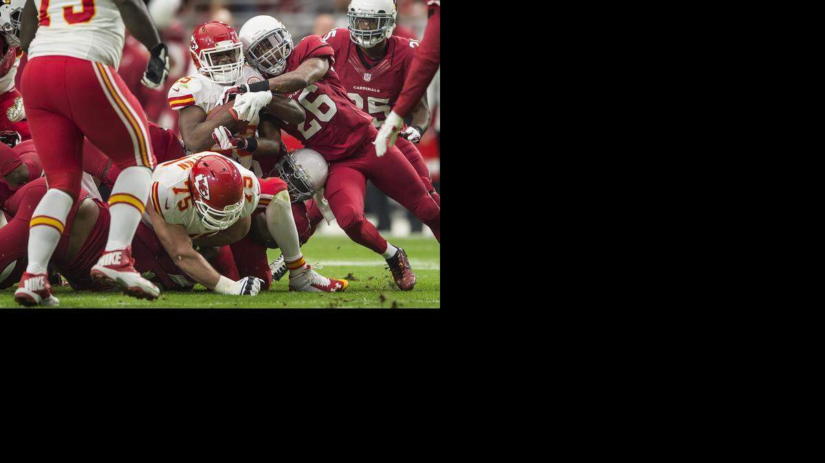 
Kansas City Chiefs running back Jamaal Charles (25) left the game after a leg injury on this first quarter running play where Charles was tackled by Arizona Cardinals free safety Rashad Johnson (26) and in NFL action on December 7, 2014 at University of Phoenix Stadium in Glendale, AZ. The Chiefs lost 17-14.
