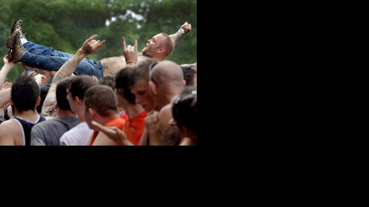 Rockfest 2014 drew tens of thousands of rock fans to the Liberty Memorial on Saturday. Even heavy rain during the set by Adelitas Way didn’t stop the crowd surfers or dampen the crowd’s enthusiasm.