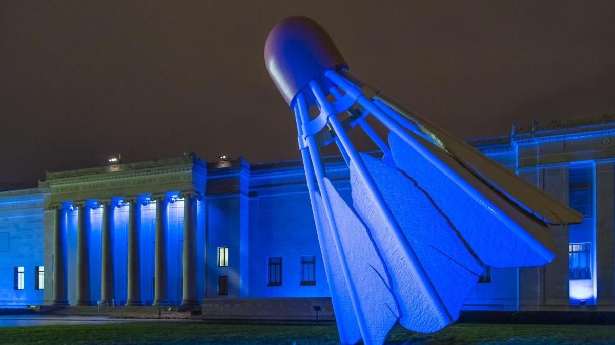 The Nelson-Atkins Museum of Art and the Shuttlecock sculpture glow blue.