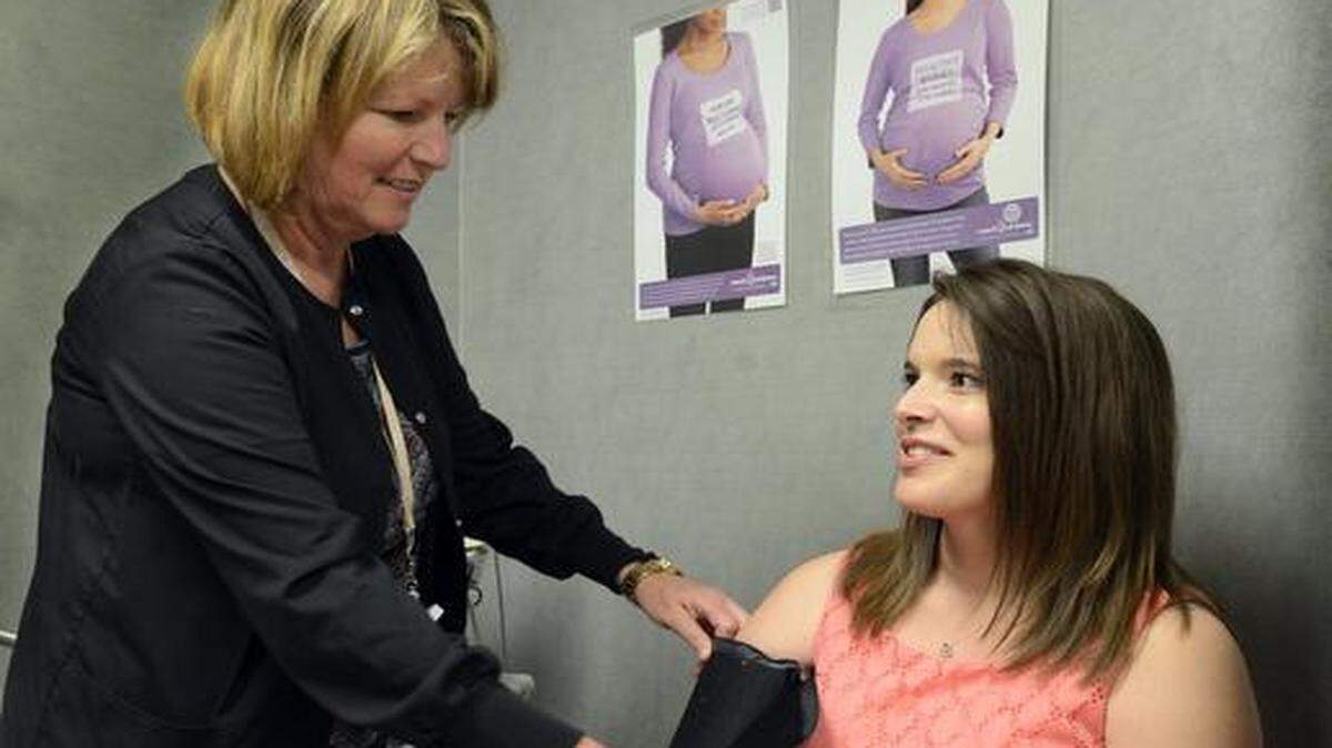 
About three years ago, the St. Luke’s Health System began a coordinated effort to reduce early elective deliveries. Last week, expectant mother Jenna Beuerlein of Leavenworth (right) visited with nurse Peg Heath during a routine checkup at St. Luke’s Women’s Center.
