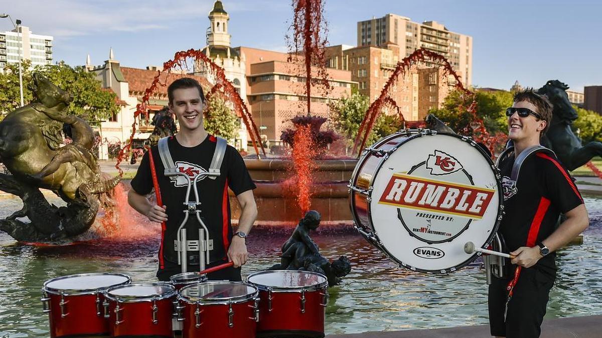 Adam Edmonds (left) and Kolby Koczanowski, members of Rumble, a drumline for the Kansas City Chiefs, played on Thursday, Sept. 17, 2015, at the Country Club Plaza in Kansas City. Workers added red dye to six major fountains across the metro area before the Chiefs’ home opener against the Denver Broncos.