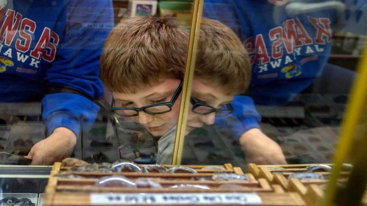 
Brookside Toy & Science was filled with customers looking to fulfill their shopping needs by participating in Small Business Saturday. Robbie Wasilewski, 9, of Nebraska, and his aunt Bethany Ladd of Belton gazed at a display case of stones and fossils.
