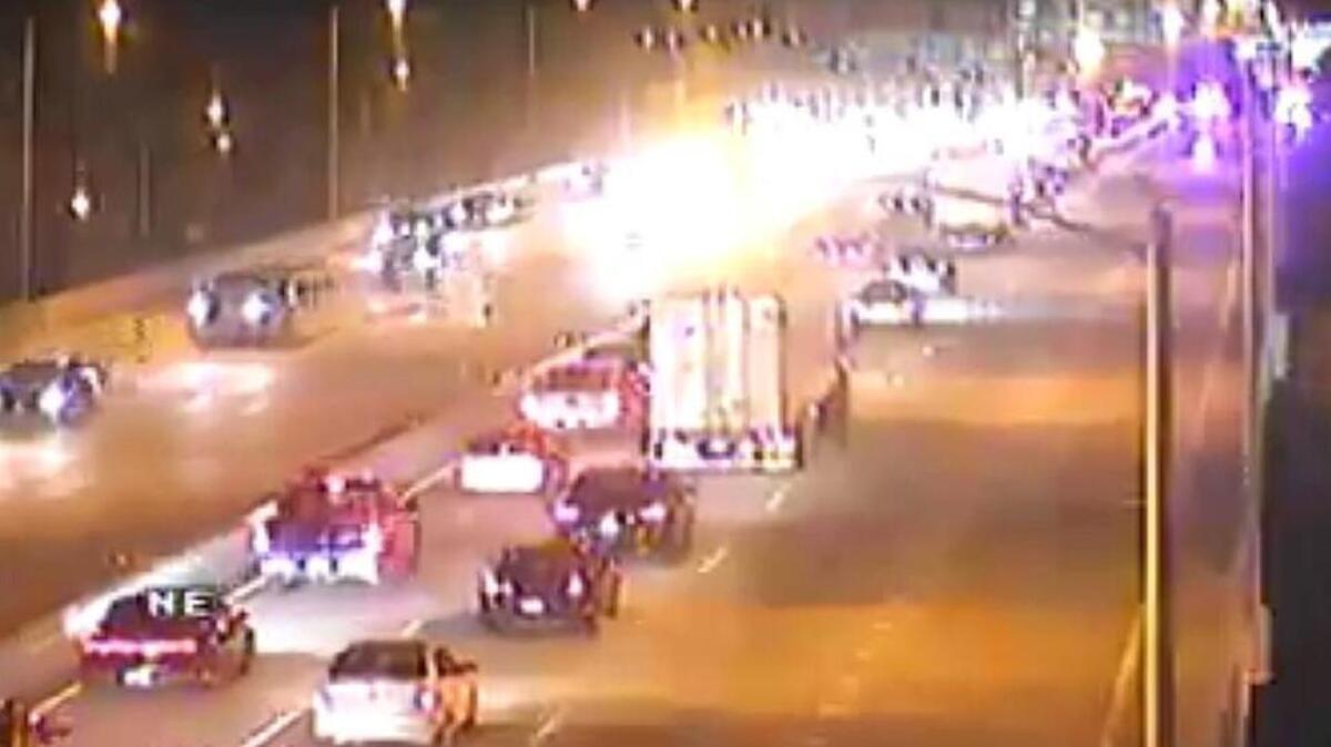 Police were searching for victims of a crash that closed two lanes of northbound Interstate 35 heading into downtown Kansas City. The car went down an embankment.